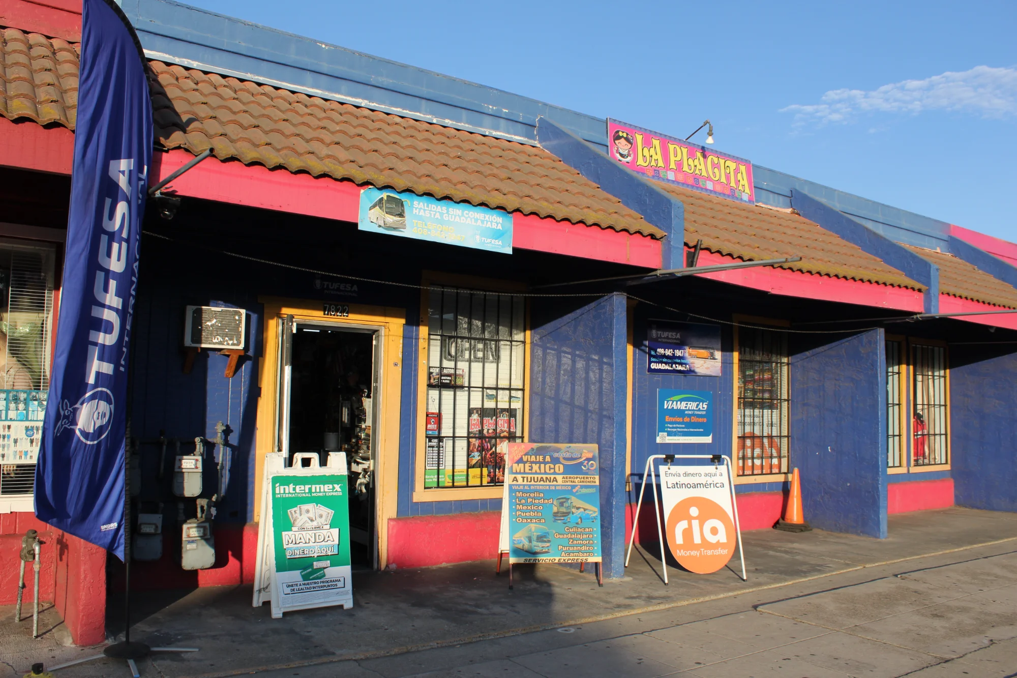 La Placita storefront with Tufesa, Intermex and Ria signs out front